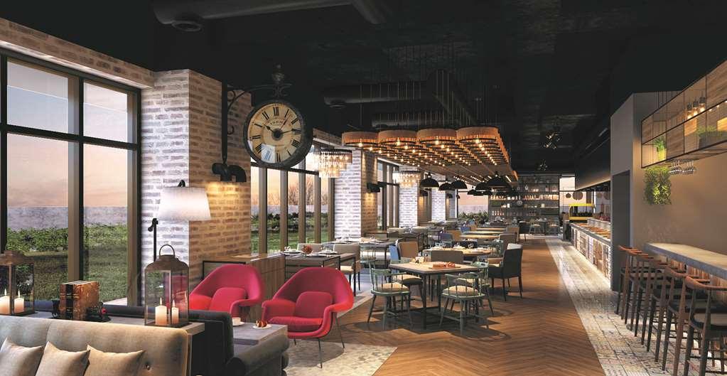 Hyatt Place Jaipur Malviya Nagar Restaurant bilde The interior of the restaurant